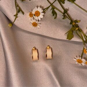 Clip in earring. Crème colored hoops with yellow gold lining